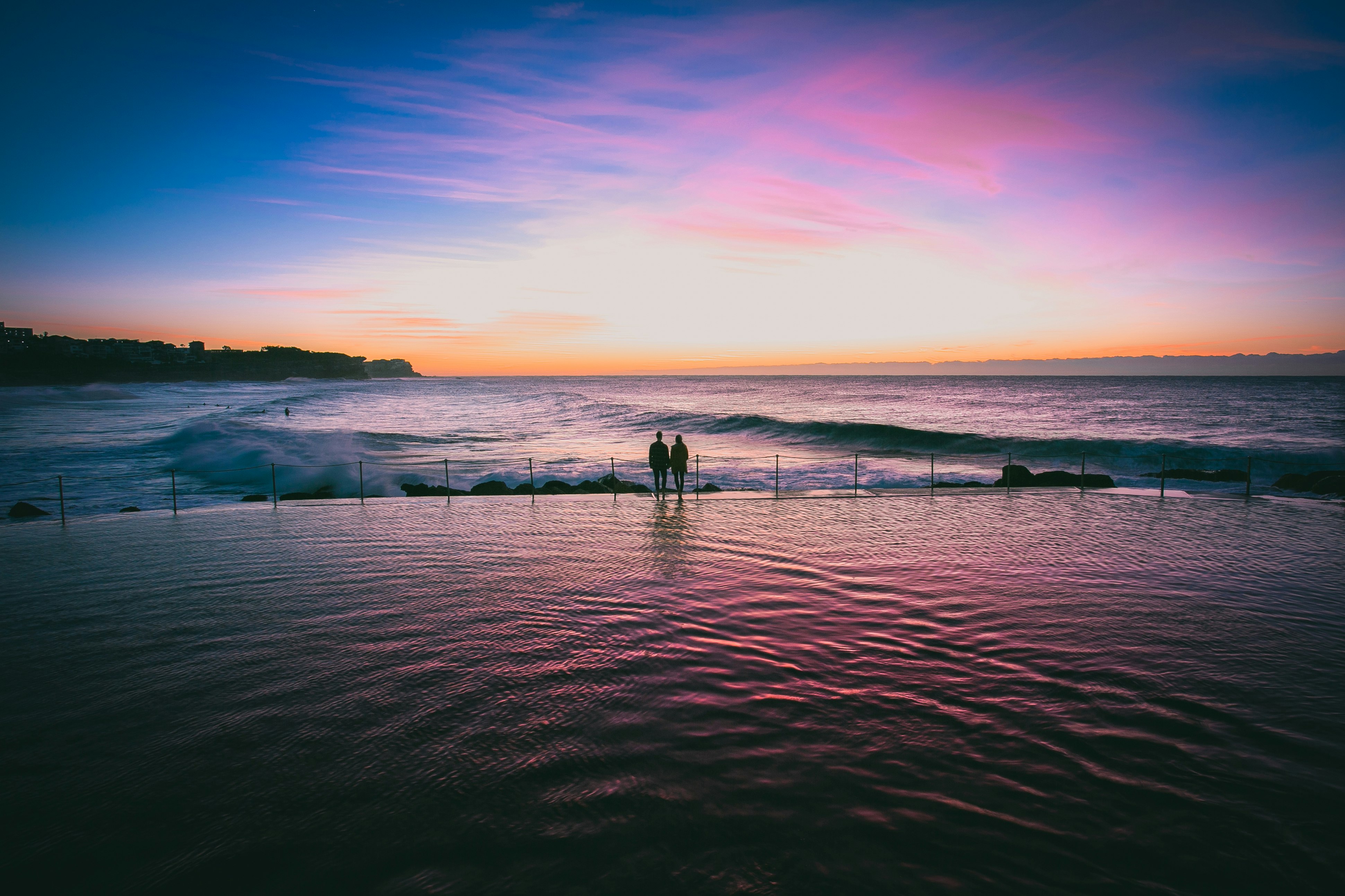 silhouette photo of couple at seashore